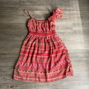 Red A-line dress with teal and cream design